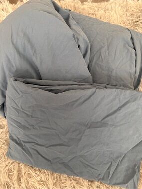 Light blue single bed set sheet, pillow case and flat sheet.